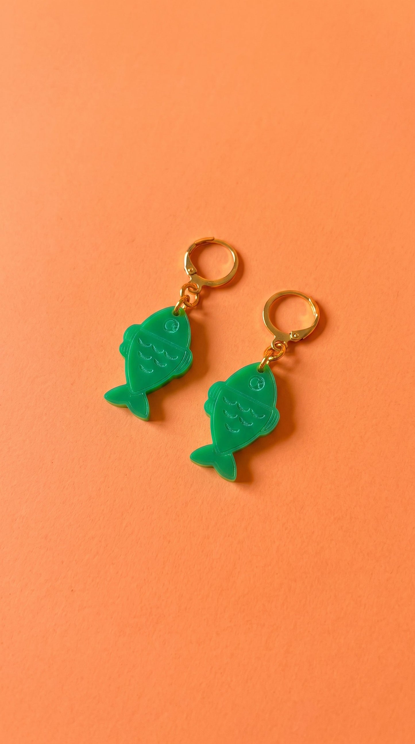 Green Fish Acrylic Earrings on Gold Huggie Hoops
