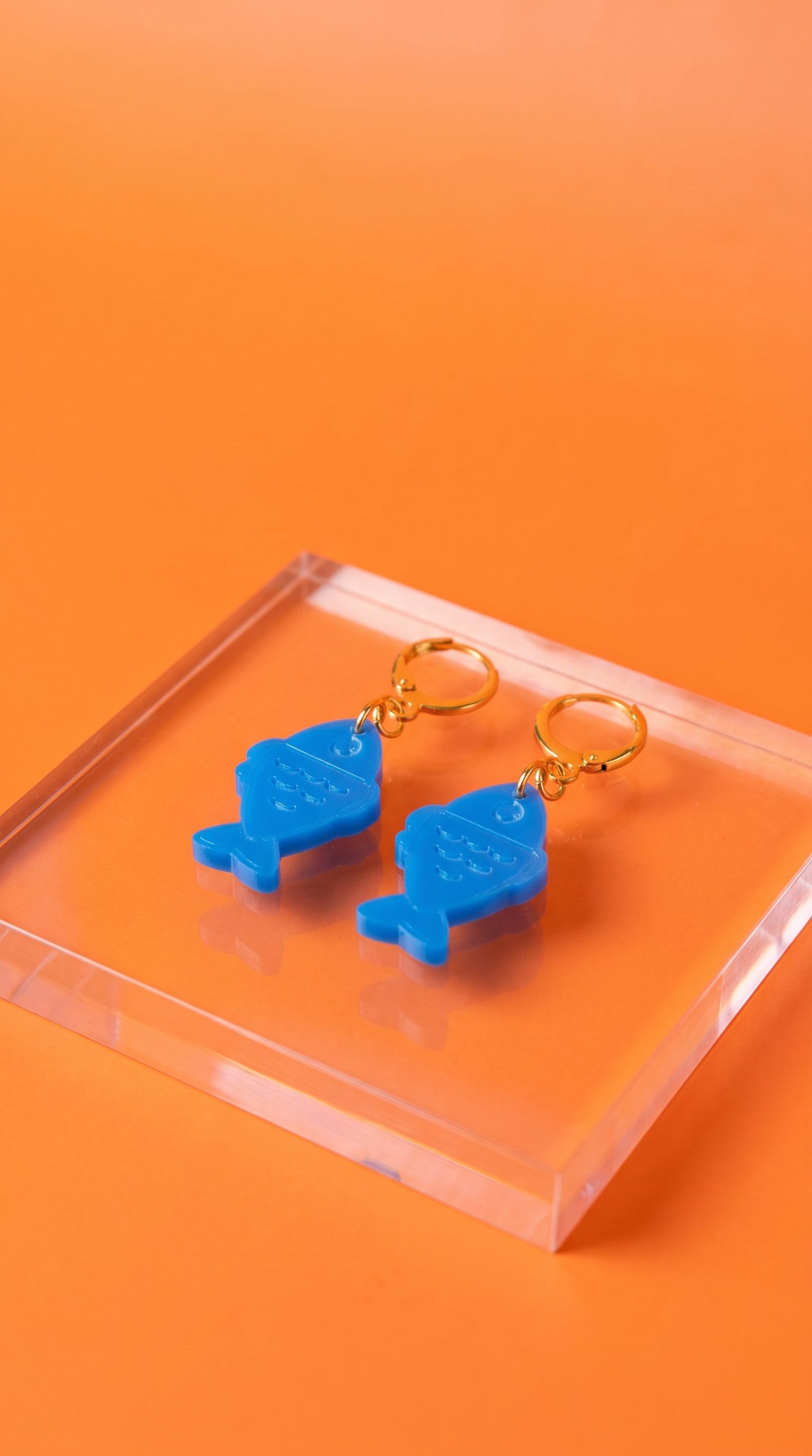 Blue Fish Acrylic Earrings on Gold Huggie Hoops