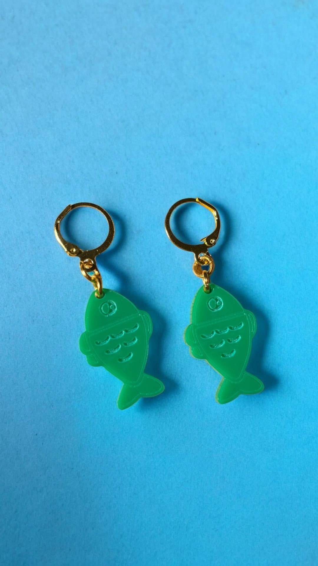 Green Fish Acrylic Earrings on Gold Huggie Hoops