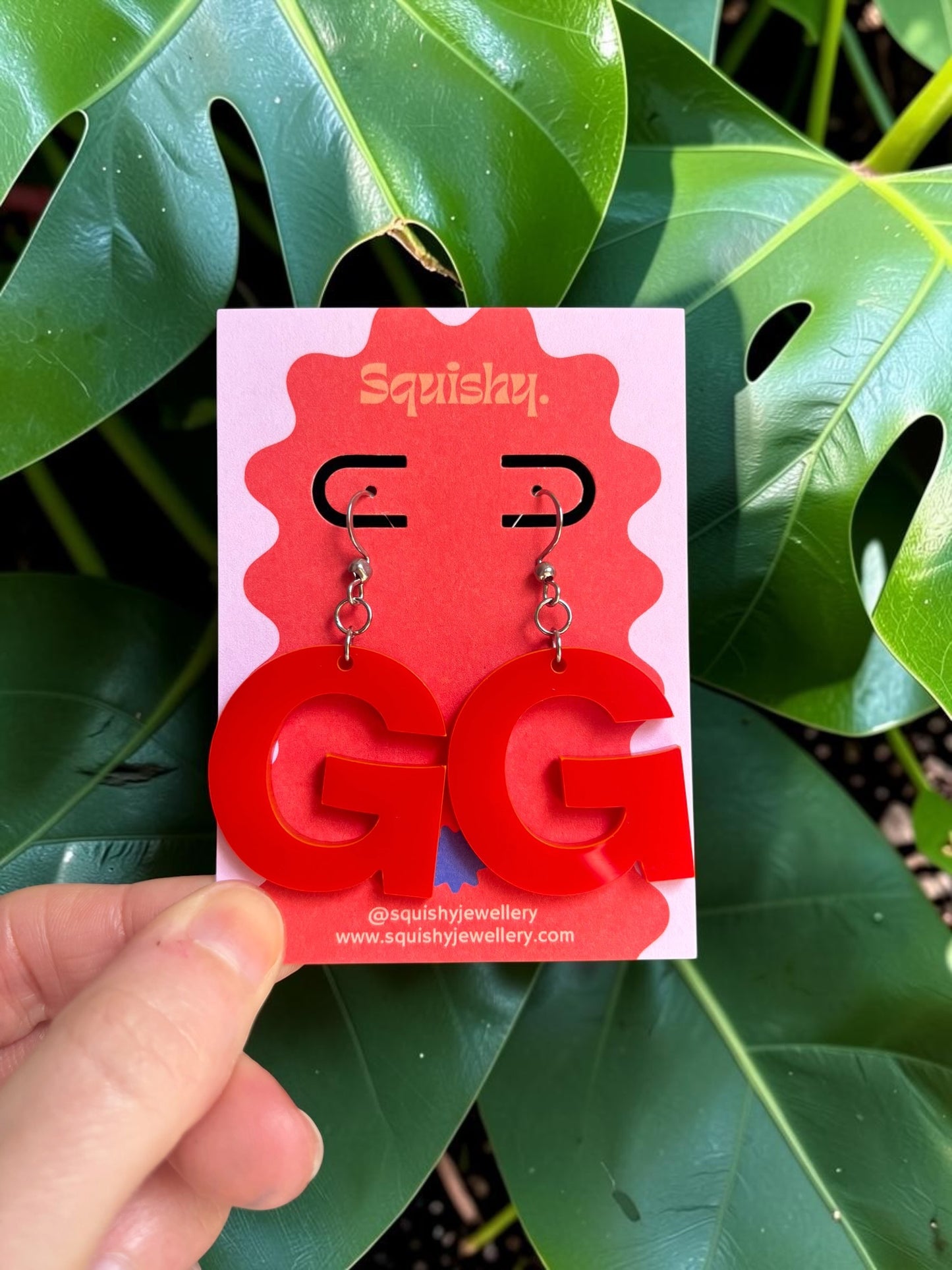 Custom logo earrings created from a business logo
