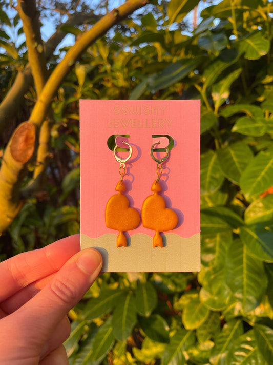 Golden Heart and Arrow Huggie Hoop Earrings – Kitsch Jewellery, Whimsygoth Accessories, Cute & Edgy Alternative Gift Idea